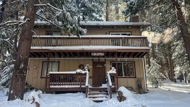 view of front of home with a balcony