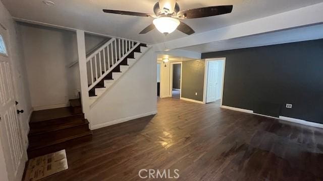 below grade area featuring stairway, wood finished floors, a ceiling fan, and baseboards
