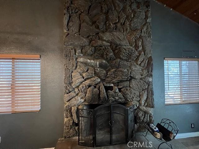 room details featuring a fireplace and baseboards