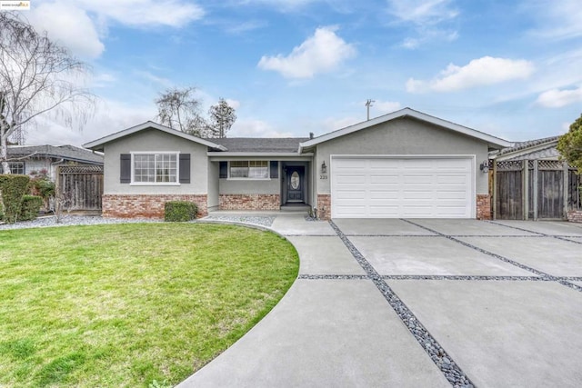 single story home with a garage and a front yard