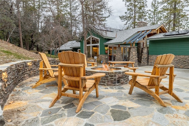 view of patio with an outdoor fire pit