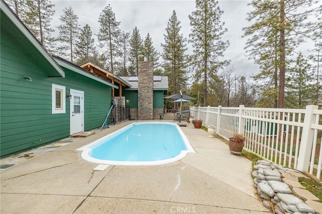 view of swimming pool featuring a patio area