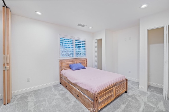 bedroom with light carpet