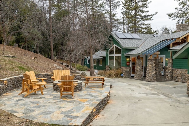 view of patio featuring a fire pit