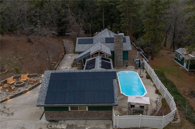 view of pool with a gazebo and a fire pit