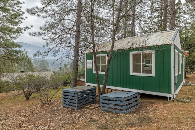 view of outbuilding with a mountain view