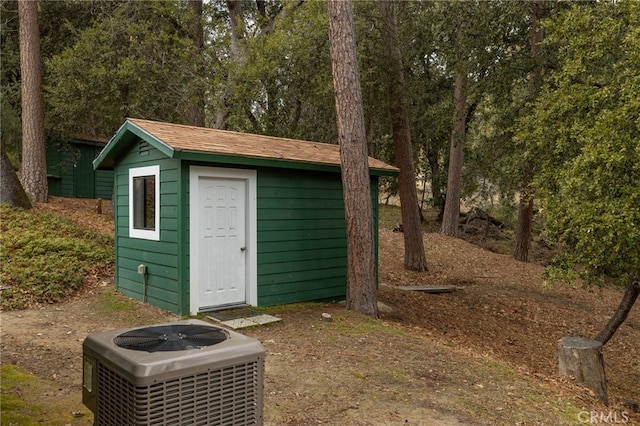 view of outbuilding with central air condition unit