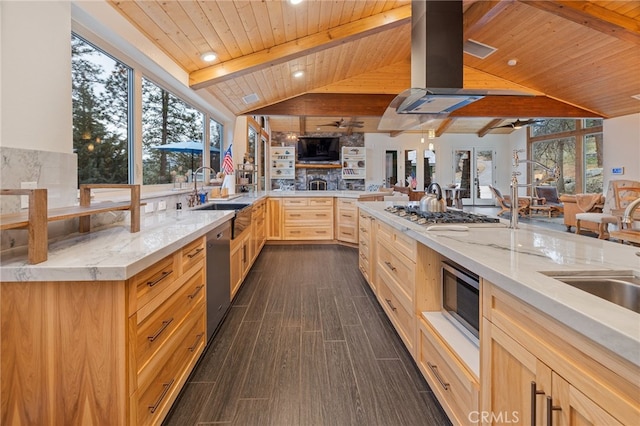 kitchen featuring sink, appliances with stainless steel finishes, lofted ceiling with beams, light brown cabinetry, and wooden ceiling