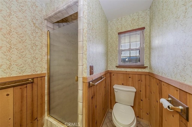 bathroom with an enclosed shower and toilet