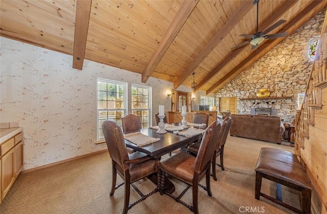 carpeted dining room with high vaulted ceiling, beamed ceiling, and wood ceiling