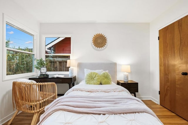 bedroom with hardwood / wood-style flooring