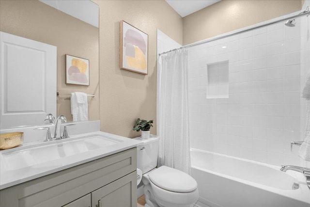 full bathroom with vanity, toilet, and shower / tub combo