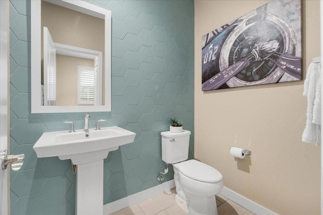 bathroom with tile patterned floors and toilet