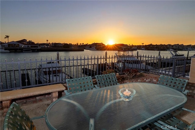 patio terrace at dusk with a water view