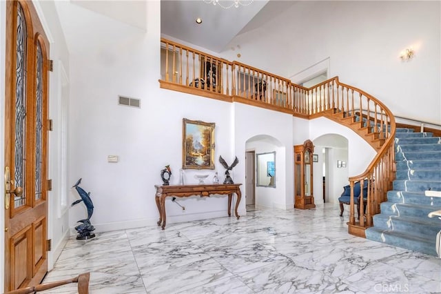 foyer featuring a high ceiling