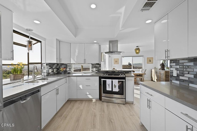 542 San Clemente Way, Camarillo, CA 93010 - kitchen with appliances with stainless steel finishes, extractor fan, recessed lighting, white cabinets, and tasteful backsplash