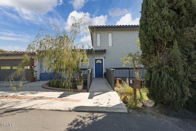 542 San Clemente Way, Camarillo, CA 93010 - view of front of home with stucco siding, a tile roof, and a garage