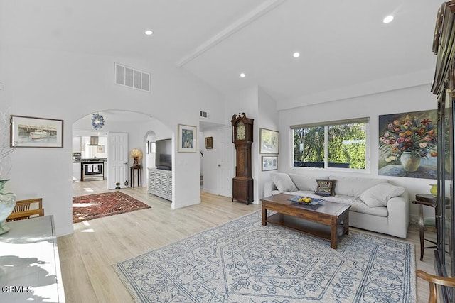 542 San Clemente Way, Camarillo, CA 93010 - living area with arched walkways, light wood finished floors, high vaulted ceiling, beamed ceiling, and recessed lighting