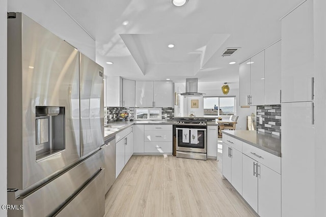 542 San Clemente Way, Camarillo, CA 93010 - kitchen with appliances with stainless steel finishes, island exhaust hood, modern cabinets, and recessed lighting