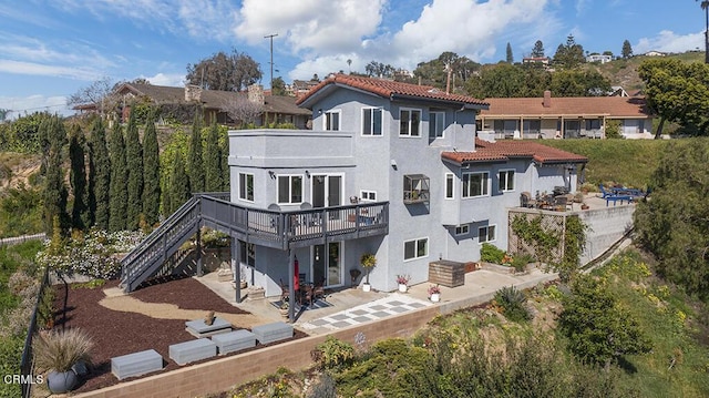 542 San Clemente Way, Camarillo, CA 93010 - back of house featuring a patio area, stairs, stucco siding, a deck, and a tile roof