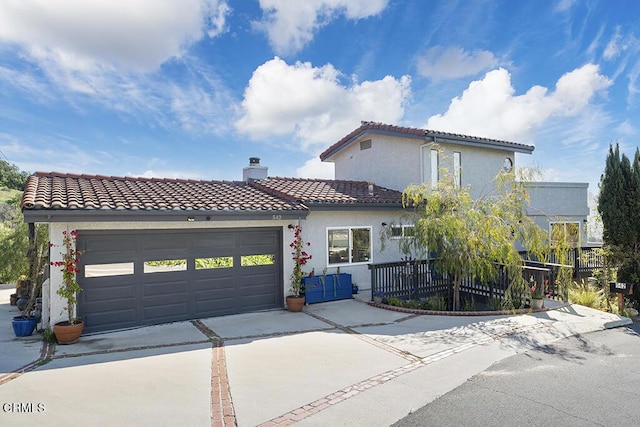 542 San Clemente Way, Camarillo, CA 93010 - mediterranean / spanish-style house with driveway, a tiled roof, a garage, stucco siding, and a chimney