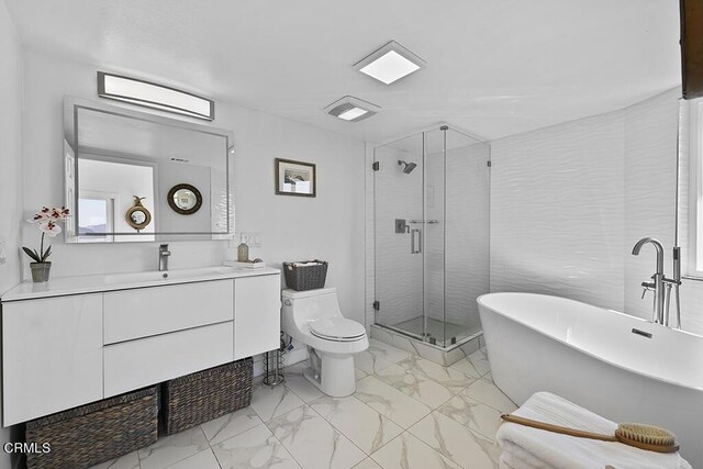 542 San Clemente Way, Camarillo, CA 93010 - bathroom featuring marble look tiles, a soaking tub, vanity, and a stall shower