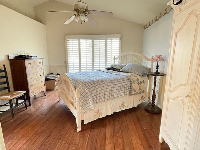 bedroom featuring lofted ceiling, dark hardwood / wood-style floors, and ceiling fan