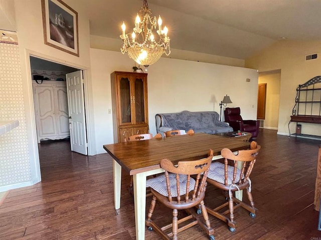 dining room featuring lofted ceiling, a notable chandelier, and dark hardwood / wood-style flooring