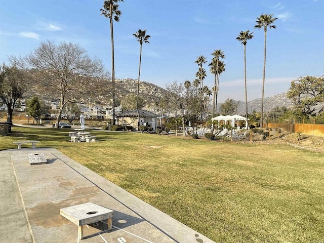 view of property's community featuring a gazebo, a mountain view, and a yard