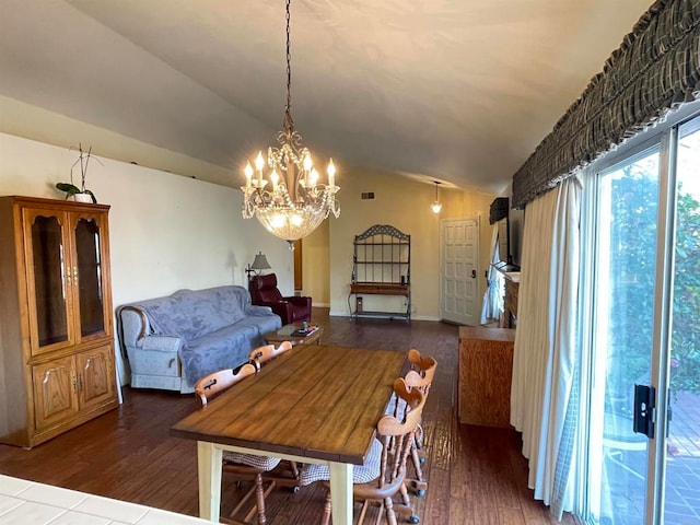 dining space with dark hardwood / wood-style flooring and vaulted ceiling