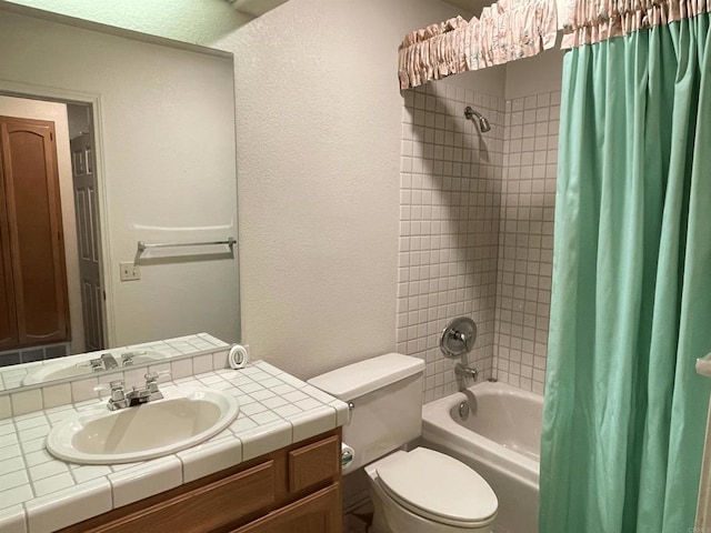 full bathroom featuring vanity, toilet, and shower / tub combo