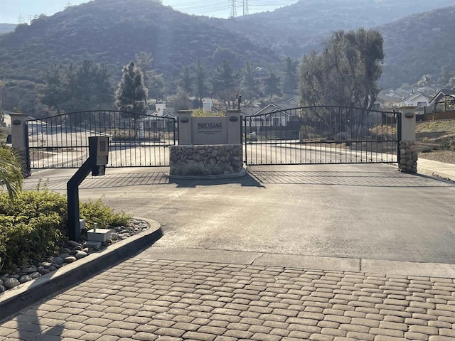 view of gate featuring a mountain view