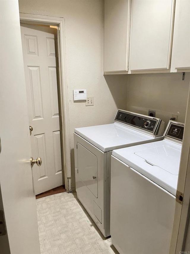 laundry room featuring cabinets and independent washer and dryer