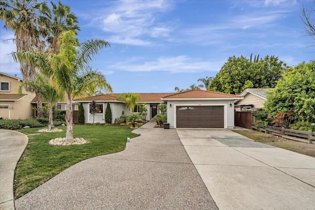 view of front facade with a garage and a front lawn