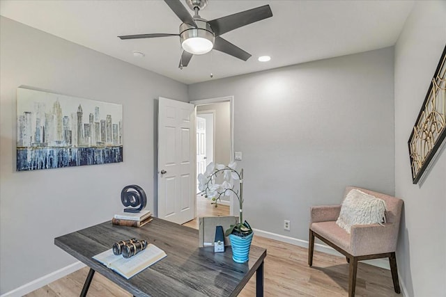 office with ceiling fan and light wood-type flooring