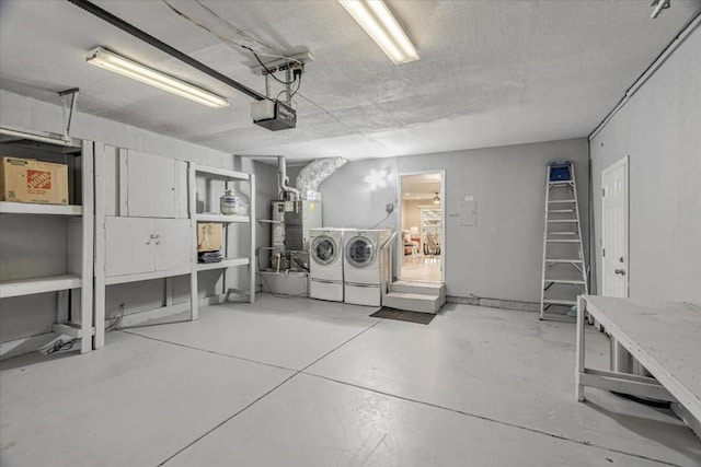 garage with separate washer and dryer, a garage door opener, and gas water heater