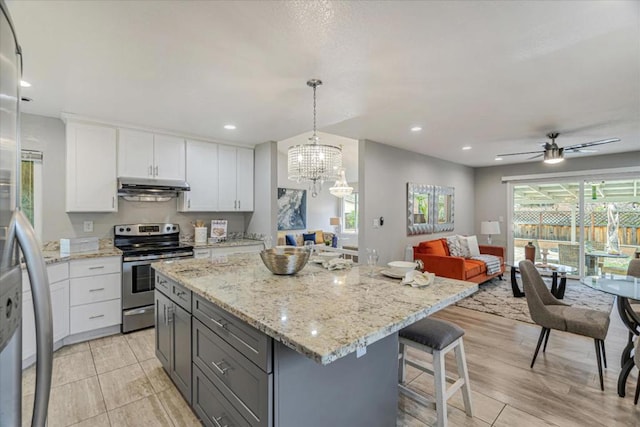 kitchen featuring stainless steel electric stove, a kitchen island, pendant lighting, white cabinetry, and gray cabinetry