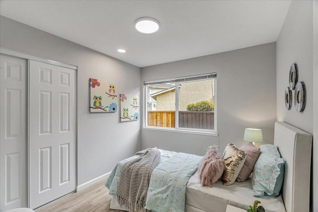 bedroom with a closet and light wood-type flooring