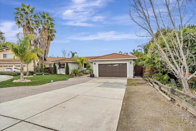 view of front of property with a garage and a front yard