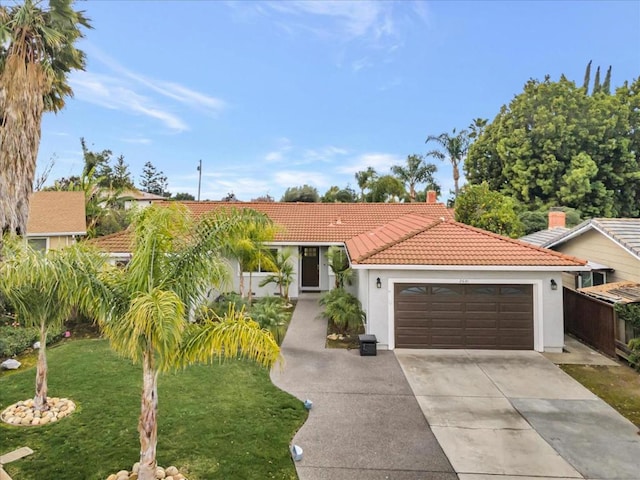 view of front facade featuring a garage and a front yard