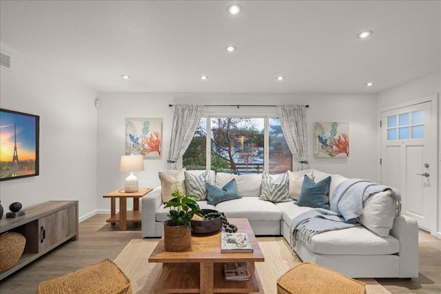 living room with light hardwood / wood-style floors