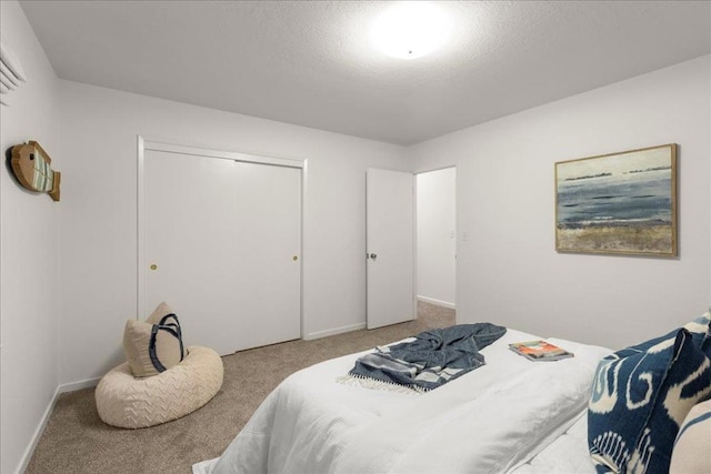 carpeted bedroom featuring a closet