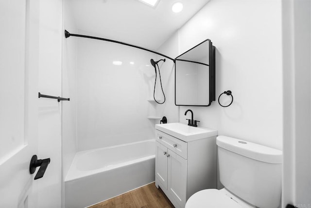 full bathroom with shower / bathtub combination, vanity, toilet, and hardwood / wood-style floors