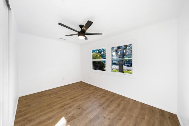 unfurnished room with wood-type flooring and ceiling fan