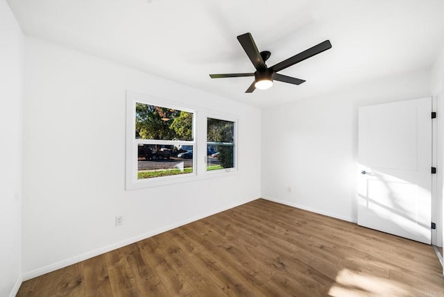 unfurnished bedroom featuring hardwood / wood-style flooring and ceiling fan