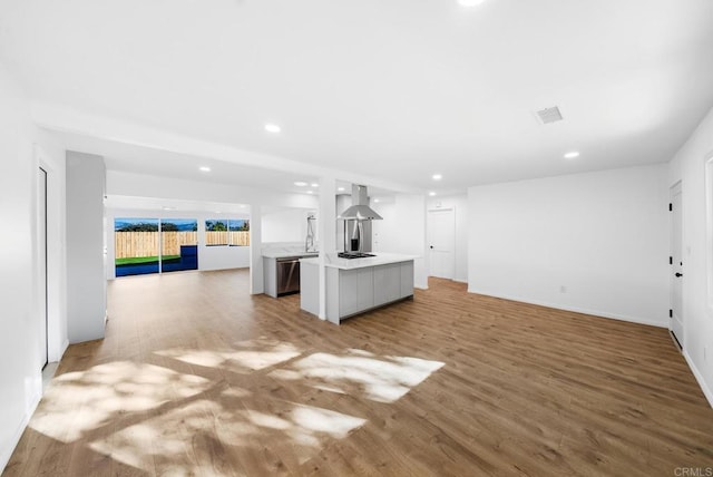 unfurnished living room featuring hardwood / wood-style floors