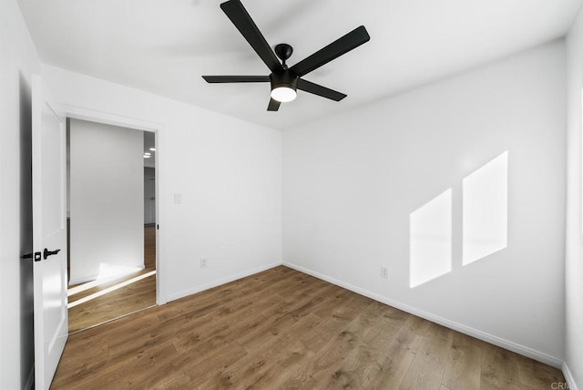 unfurnished bedroom featuring hardwood / wood-style flooring and ceiling fan