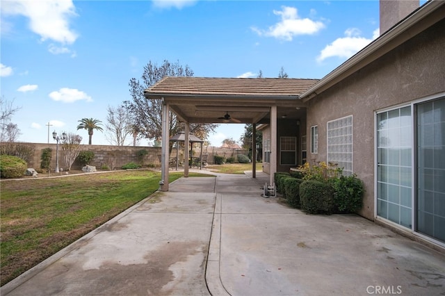 view of patio featuring ceiling fan