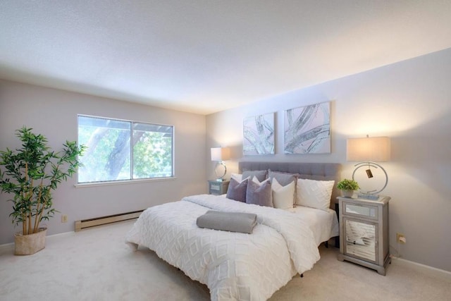 carpeted bedroom featuring a baseboard radiator