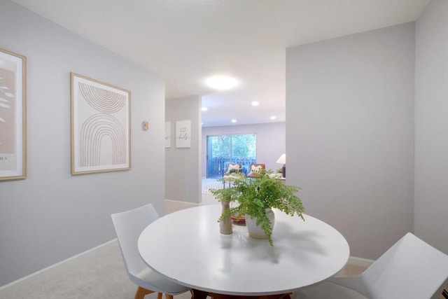 view of carpeted dining space